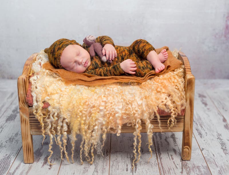 Sleeping Newborn on Little Bed with Fluffy Blanket Stock Photo Image