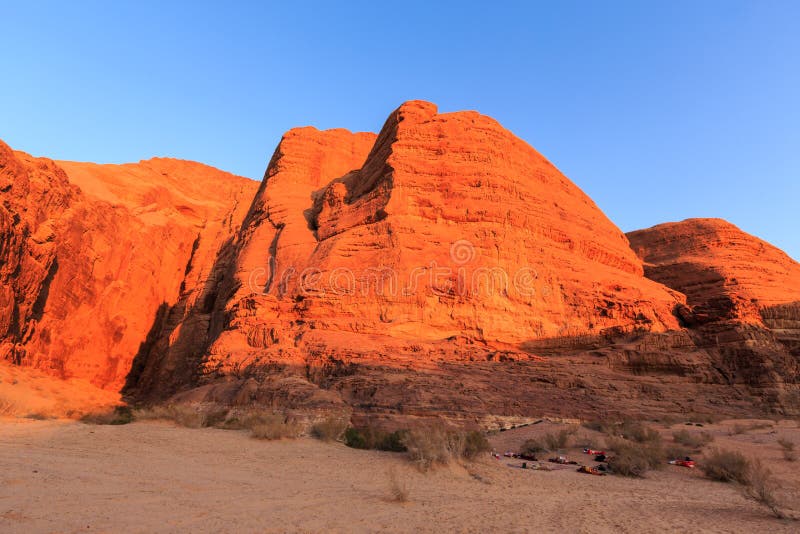 Sleeping Outdoors on the Ground with Red Colored Rocks in the Wa Stock