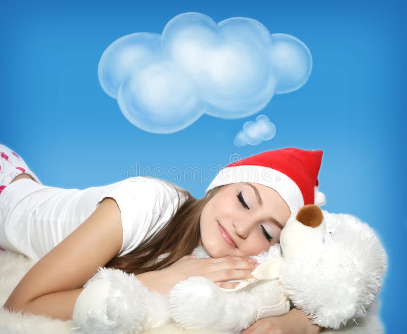 Sleeping young girl with teddy bear