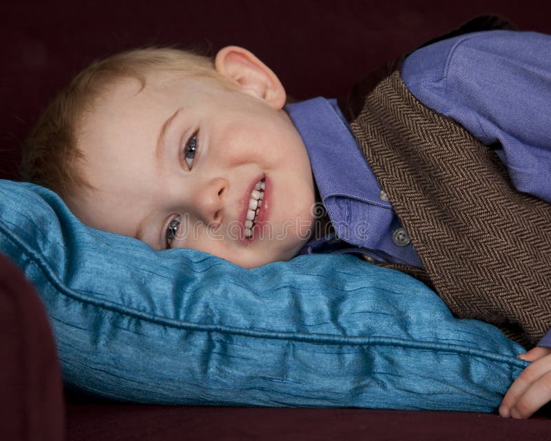 Sleepy boy on pillow stock photo. Image of pillow, home 24902754