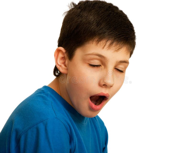 A kid is yawning with closed eyes; isolated on the white background. Boring kid white stock images, royalty-free photos and pictures