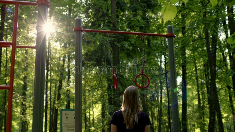 280+ Gymnastic Rings Outdoors Women Exercising Stock Photos