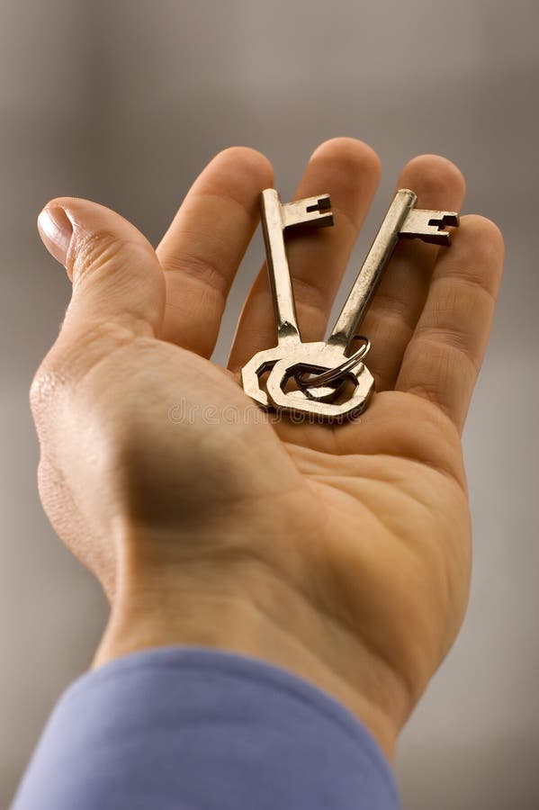 Keys in business men hand close up. Keys in business men hand close up