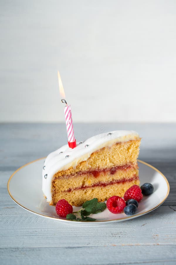 Slice of Birthday Cake with Candle and Berries Stock Photo Image of
