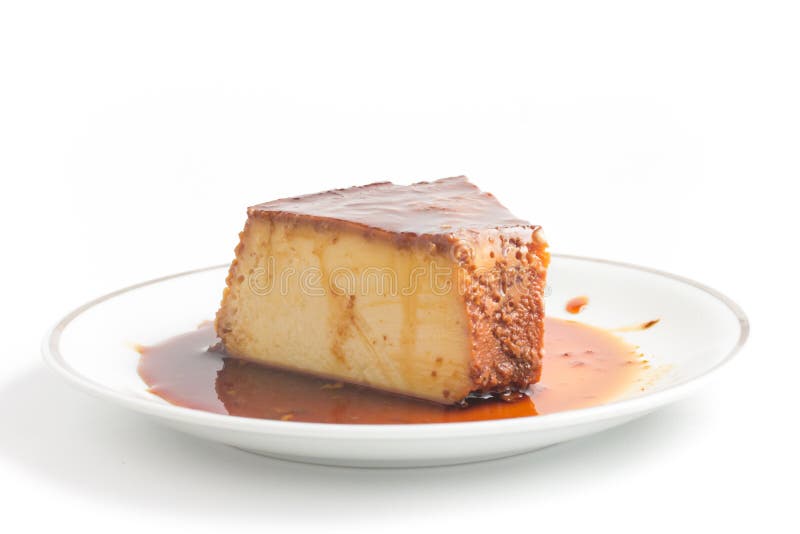 Slice of Brazilian Milk Pudding on white background