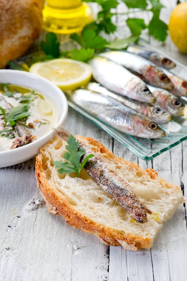 Slice bread with anchovy stock photos