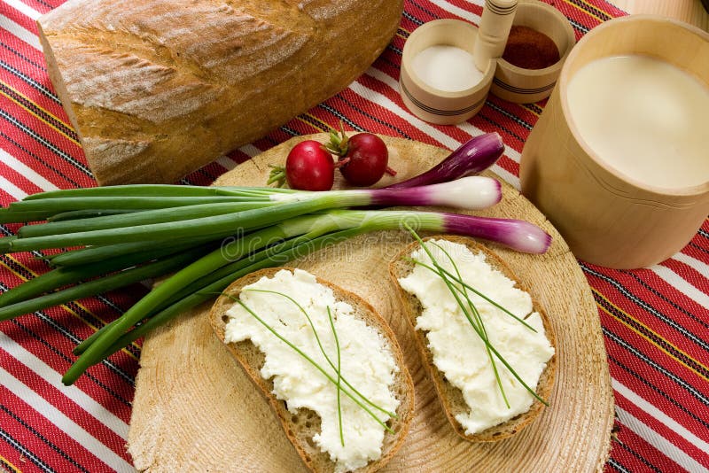 Slice of bread spread with sheep cheese