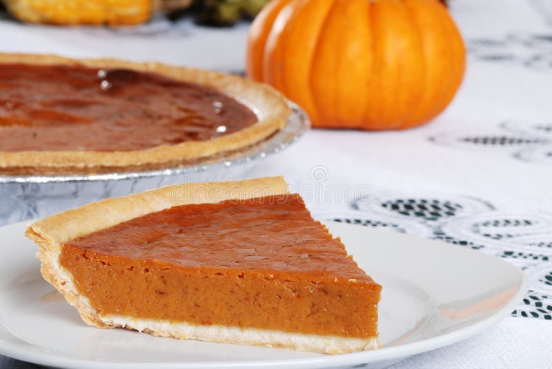 Slice of fresh baked pumpkin pie royalty free stock photos