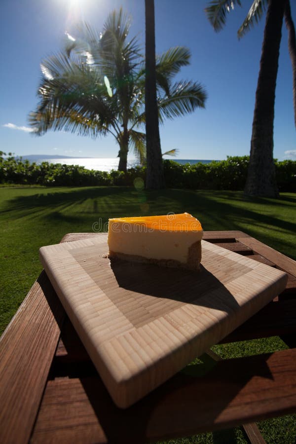 Slice of Lilikoi Cheesecake on a Beautiful Hawaiian Day Stock Image