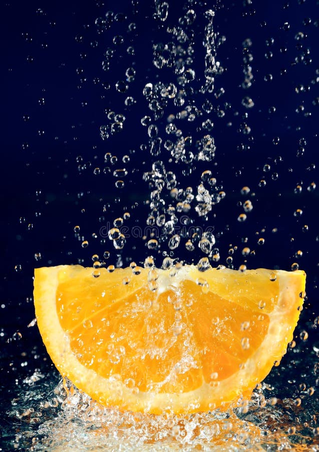 Slice of orange with water drops