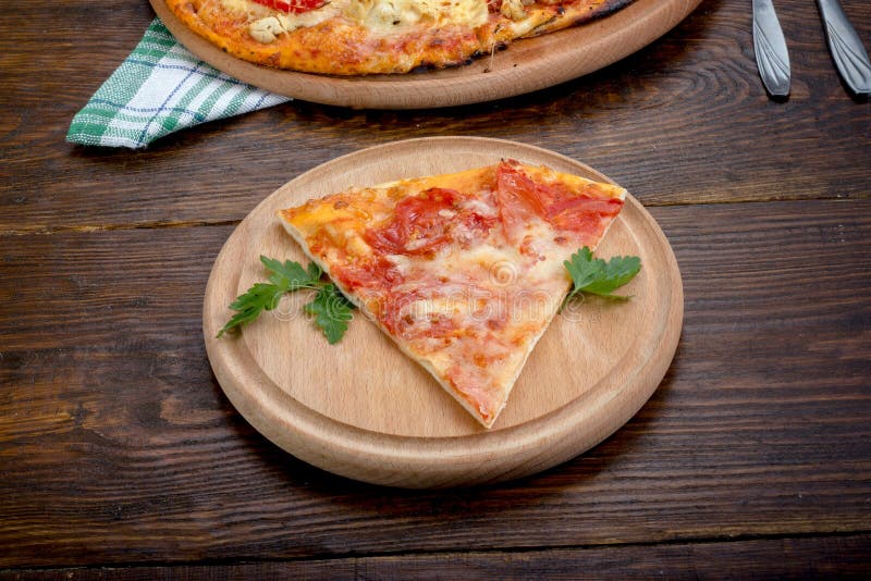 Slice of pizza on a plate stock photo. Image of restaurant - 70122378