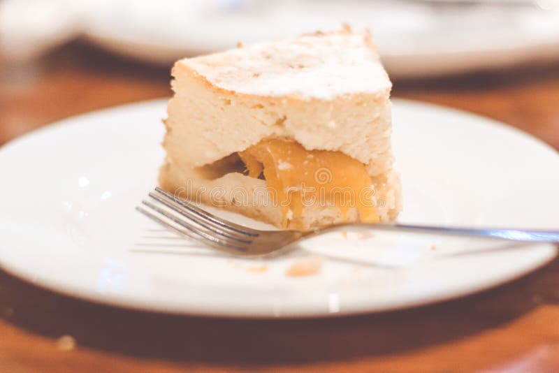Slice of plain cheesecake. Peach cheesecake. stock photos Slice of plain cheesecake. Peach cheesecake. stock photos