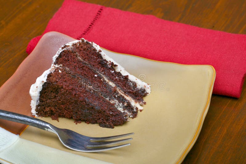 Slice of rich moist chocolate cake