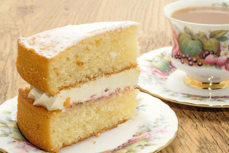Slice of Victoria sponge cake with a hot drink stock photos Slice of Victoria sponge cake with a hot drink stock photos