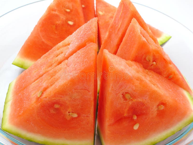 Slice watermelon in clean dish on white background royalty free stock photo