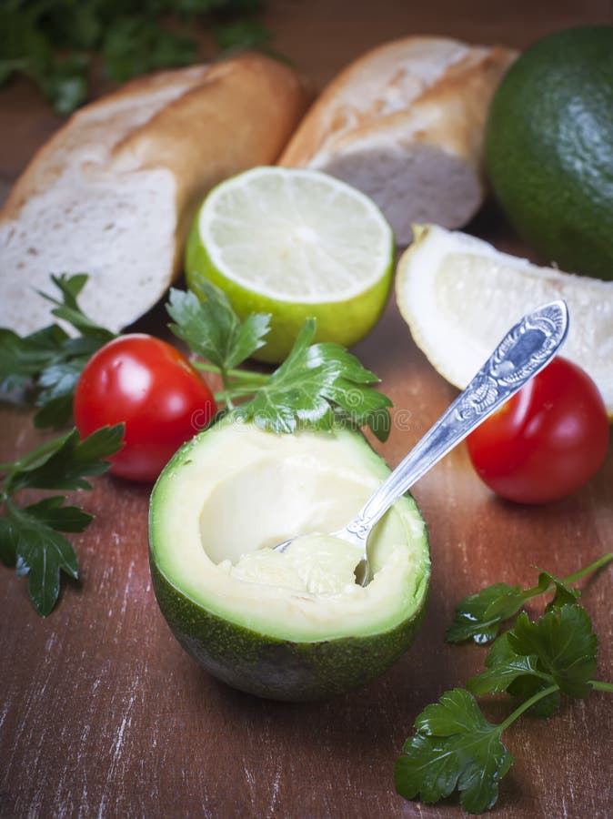 Sliced Avocado, Complete with Spoon Ready To Eat Stock Image Image of