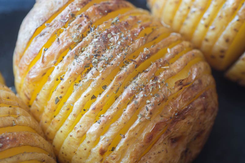 Sliced Baked Potatoes with Herbs Stock Photo - Image of appetizer ...