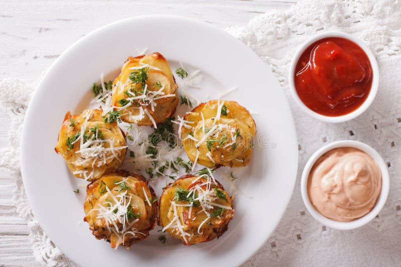 Sliced Baked Potato with Cheese and Sauce Close-up. Horizontal T Stock