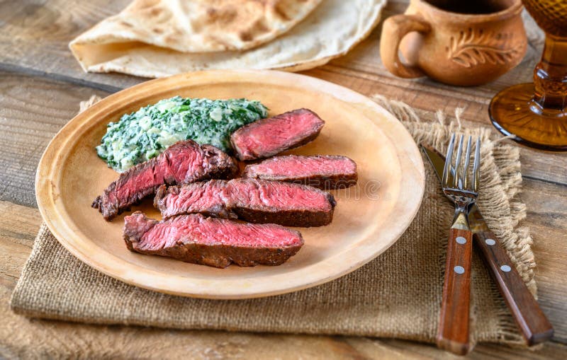Beef Steak with Creamy Spinach Stock Image - Image of grilled, loin
