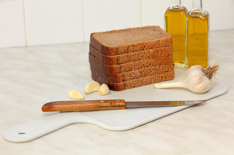Sliced Bread,garlic and Olive Oil on Kitchen Table. Stock Image Image of cooking, olive 51486269