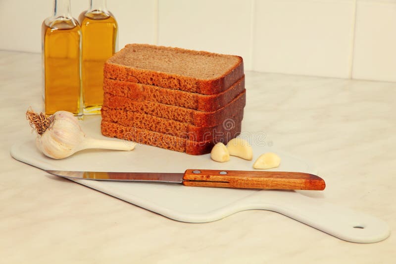 Sliced Bread,garlic and Olive Oil on Kitchen Table. Stock Photo Image of cook, nutrition 51486728