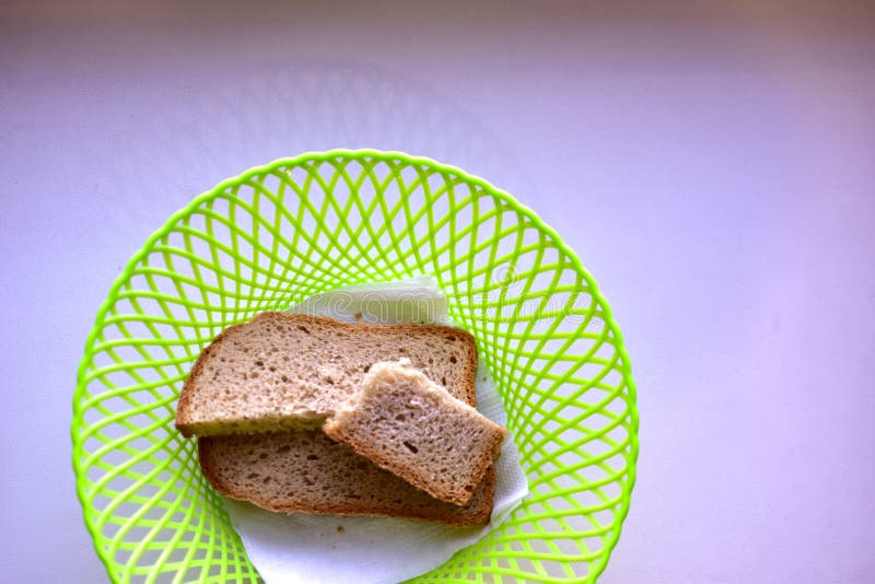 Sliced Bread in a Plastic Bread Plate on a White Background Stock Photo