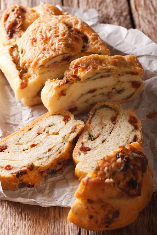 Sliced bread stuffed with cheese and bacon and dried tomatoes cl