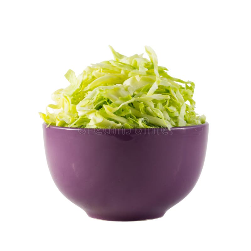 Sliced cabbage in purple bowl stock photos