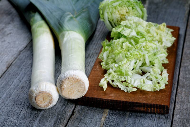 Sliced cabbage and shallots on a table stock photo