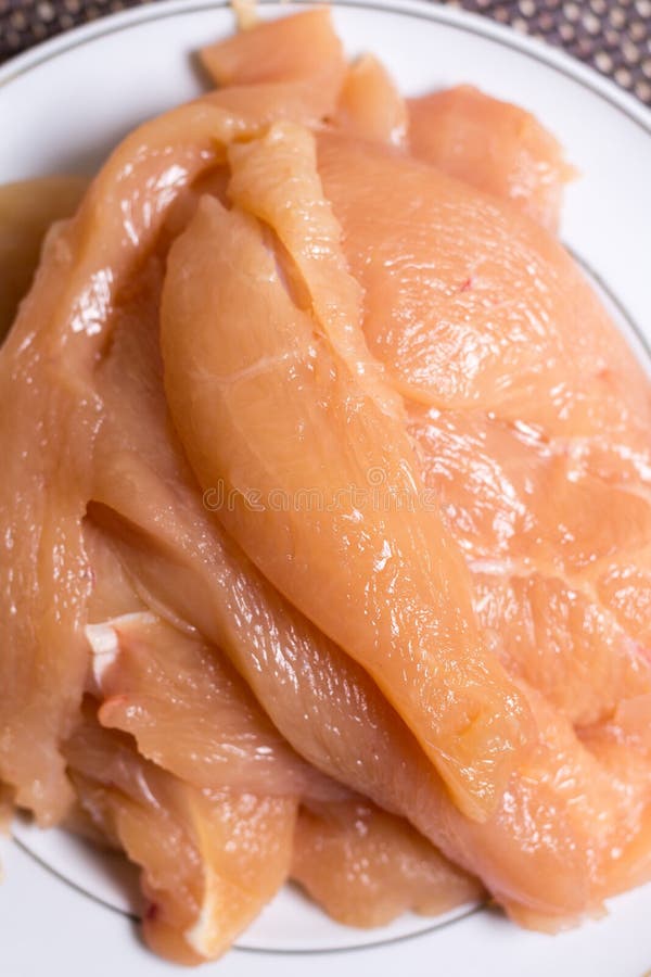 Sliced Chicken White Meat Breasts Filet on the Plate Stock Photo