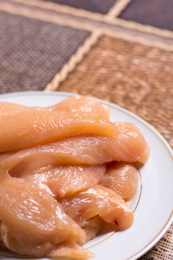Sliced Chicken White Meat Breasts Filet on the Plate Stock Photo