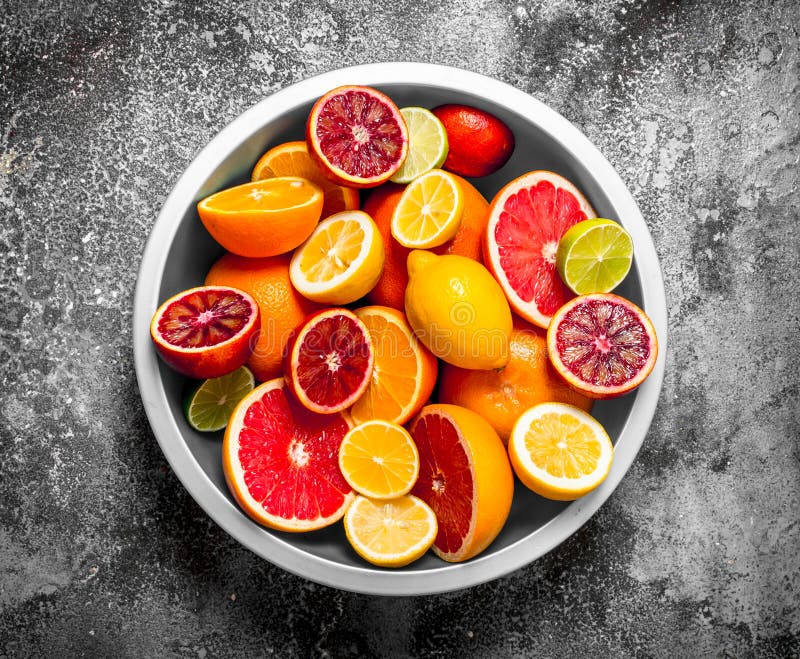 Sliced Citrus Fruits In A Large Bowl . Stock Image Image of juice