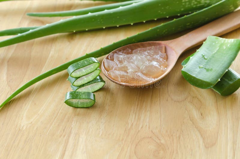 Sliced and leaf of fresh aloe vera with aloe vera gel product on