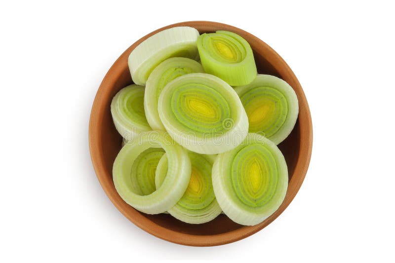 Sliced Leek vegetable in ceramic bowl isolated on white background. Top view. Flat lay royalty free stock photo