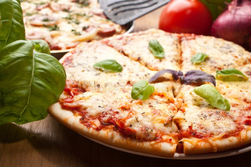 Sliced pizza margarita stock images Sliced pizza margarita stock images