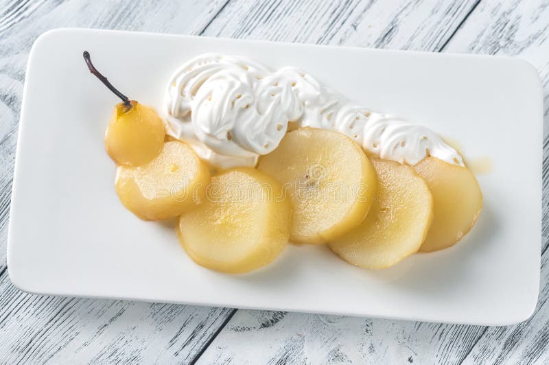 Sliced poached pear with whipped cream