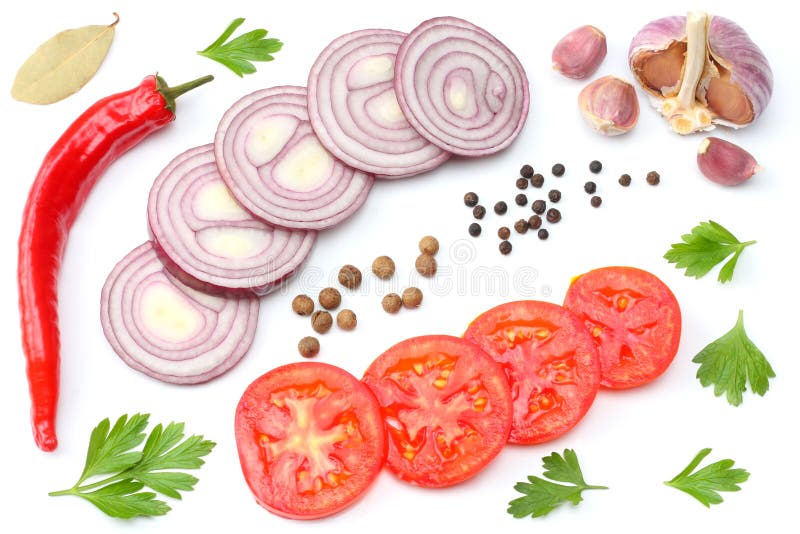 sliced red onion, red hot chili pepper, tomato, garlic and spices isolated on white background. top view