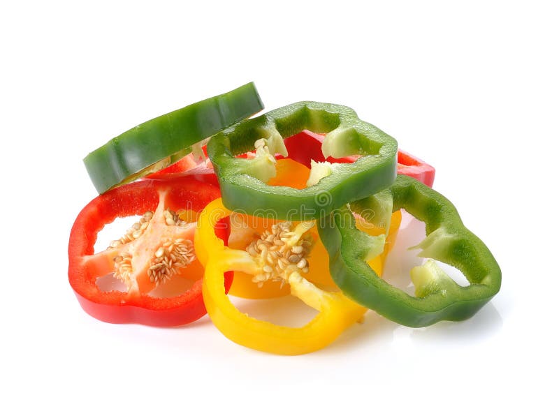 Sliced red yellow green pepper isolated on white