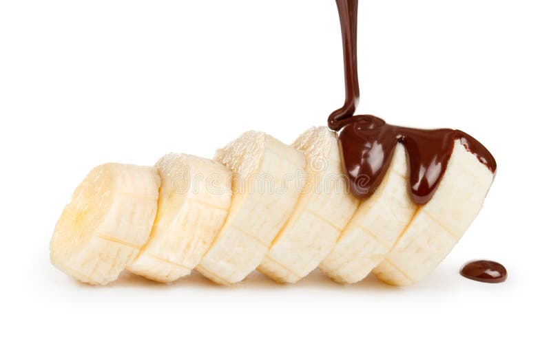 Sliced ripe banana with chocolate pouring stock photography
