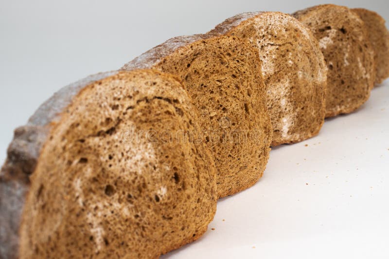 Slices of Rye Bread, Covered with Mold, with Dry Spikelets Stock Photo