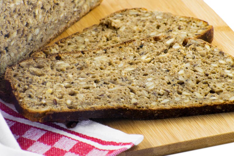 Sliced Rye Bread on Cutting Board. Whole Grain Rye Bread with Seeds. Delicious Whole Grain Bread