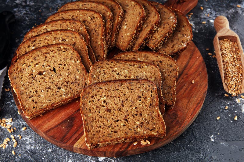 Sliced Rye Bread on Cutting Board. Whole Grain Rye Bread with Seeds on