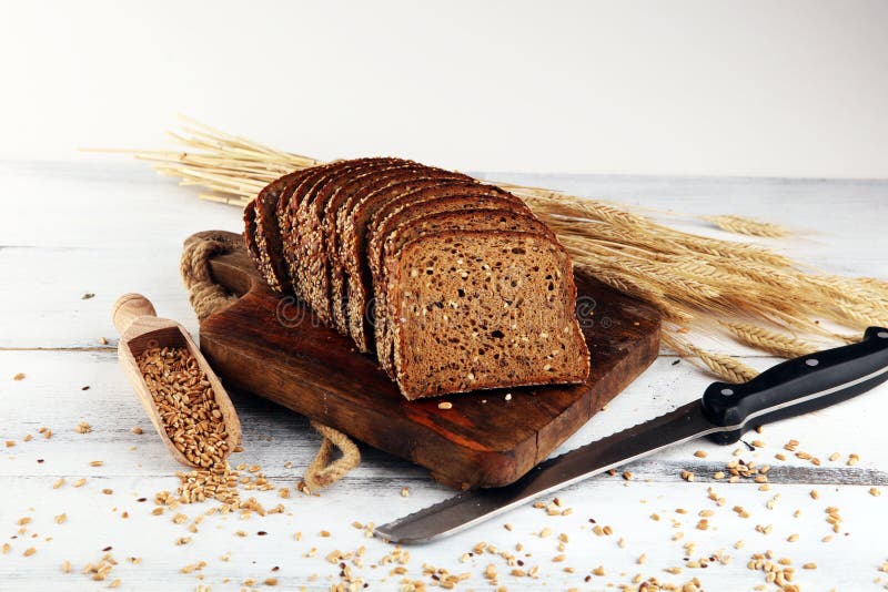 Sliced Rye Bread on Cutting Board. Whole Grain Rye Bread with Seeds on Table Stock Image Image