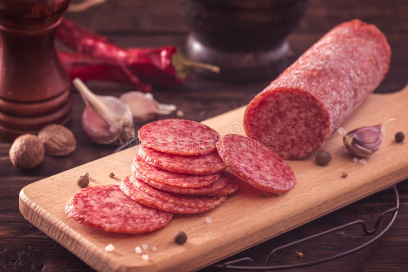 Sliced salami on board