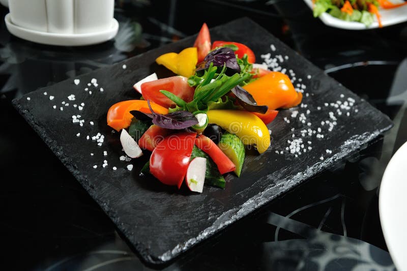 Sliced vegetables on a wooden board in a restaurant, cucumbers, royalty free stock photo Sliced vegetables on a wooden board in a restaurant, cucumbers, royalty free stock photo