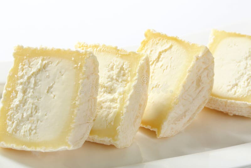Sliced white rind cheese stock photo. Image of heap, slice 62156098