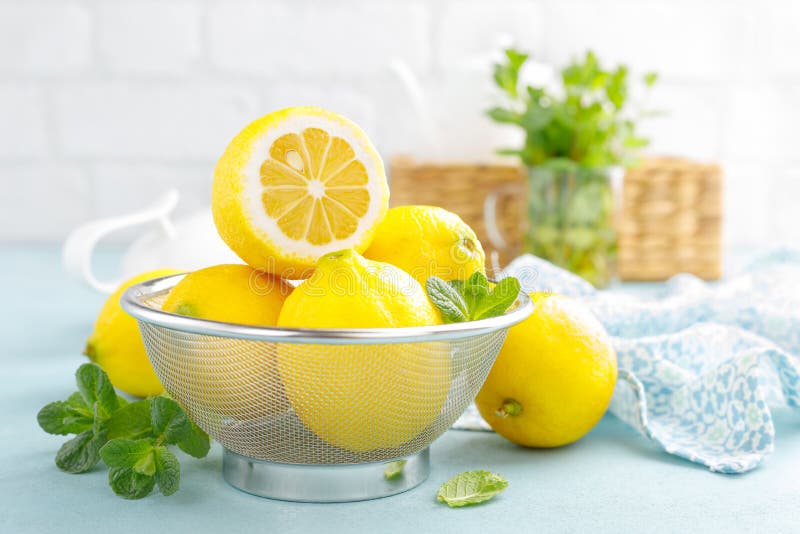 Sliced and whole lemons with mint royalty free stock images