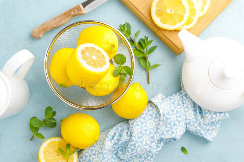 Sliced and whole lemons with mint royalty free stock photos