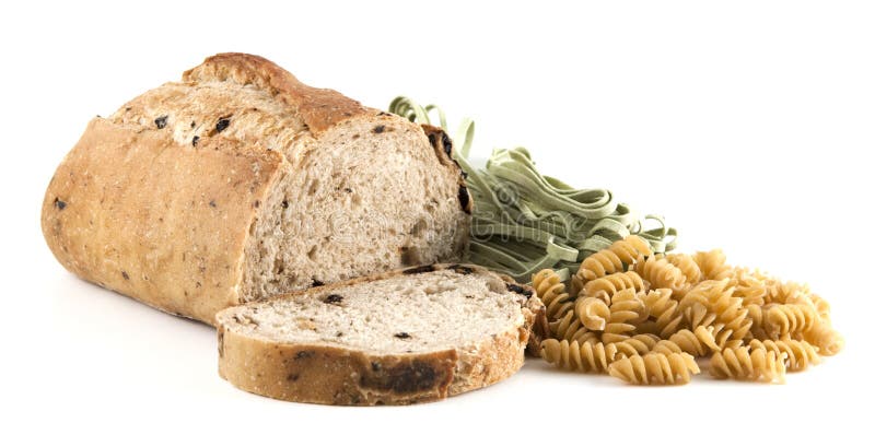 Sliced whole wheat olive bread and pasta stock photo