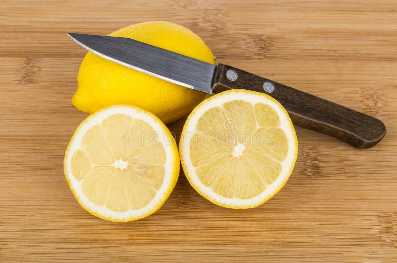 Sliced Yellow Lemon and Knife on Table Stock Image Image of sour, close 72100411